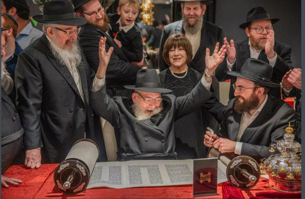 Family Unites in Joyous Celebration: Honoring Parents' 60th with Torah Completion Ceremony